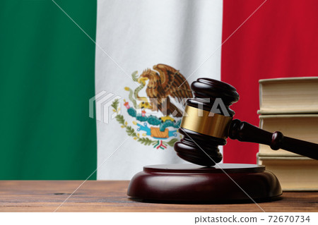 Justice and court concept in United Mexican States. Judge hammer on a Mexico flag background 72670734