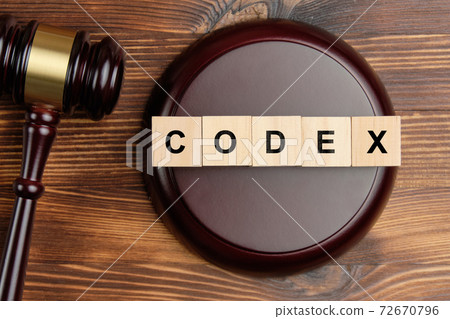 Codex word on wooden blocks next to judge hammer Codex word on wooden blocks next to judge hammer 72670796
