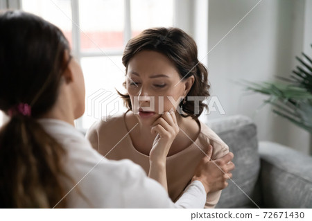 Close up caring grownup daughter comforting upset mature mother 72671430