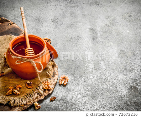 Fresh honey with nuts. 72672216