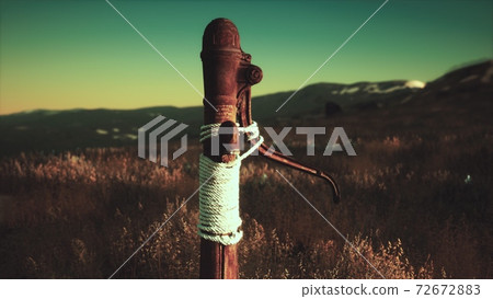 old hand water pump on dry hills old hand water pump on dry hills 72672883