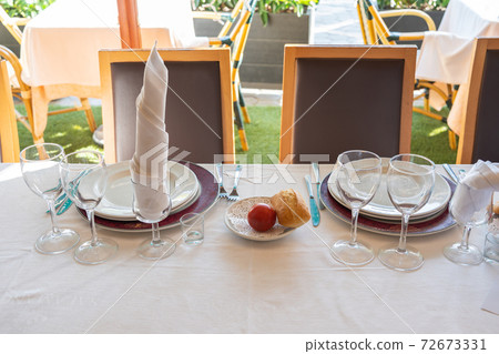 Wedding banquet table with beautiful decoration and tableware setup Wedding banquet table with beautiful decoration and tableware setup 72673331