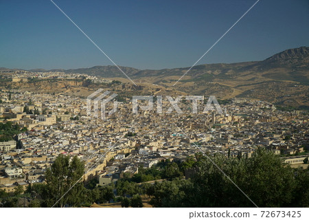 View of the labyrinth city of Fes from the top of the hill (Morocco) View of the labyrinth city of Fes from the top of the hill (Morocco) 72673425