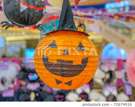 Orange jack o lantern with spooky smile for Halloween decoration 72674016