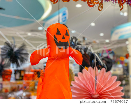 Jack o pumpkin hanging on ceiling for halloween holiday decoration 72674017