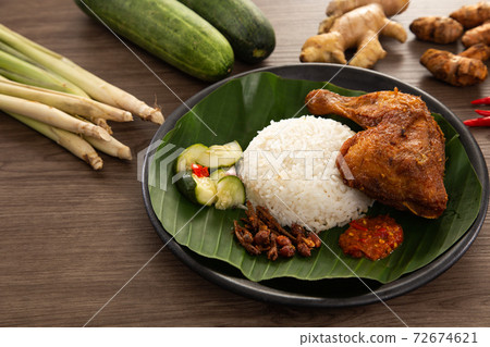 Nasi Kukus is usually comprising freshly steamed rice and crispy fried chicken 72674621