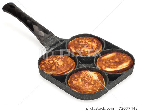 Frying pan for pancakes top view. Cooking pancakes. Isolated on white 72677443