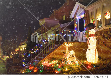 A street decorated for Christmas and New Year holidays in the Dyker Heights neighborhood, New York A street decorated for Christmas and New Year holidays in the Dyker Heights neighborhood, New York 72679161