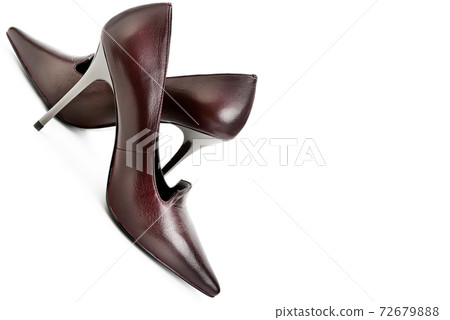 Brown female shoes isolated on white background. Free space for text. 72679888