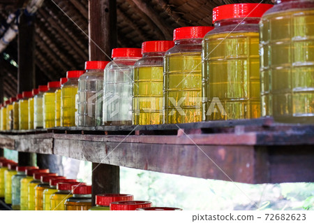 The process of making vinegar by the traditional Thai method. The process of making vinegar by the traditional Thai method. 72682623