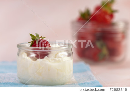 Strawberries in a glass jar 72682846
