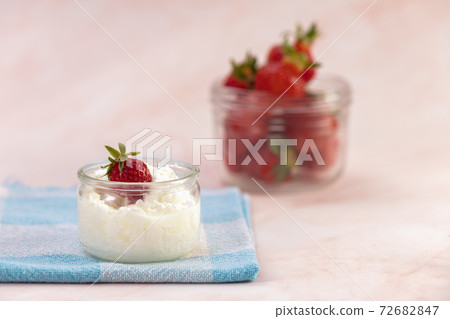 Strawberries in a glass jar 72682847