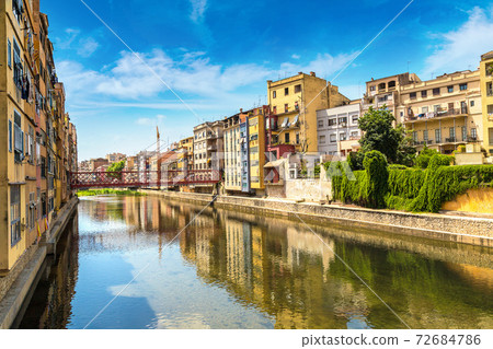 Colorful houses and Eiffel bridge in Girona Colorful houses and Eiffel bridge in Girona 72684786