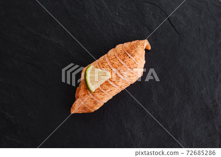Sushi with seared salmon on slate plate 72685286