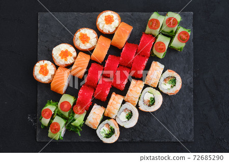 Big set of rolls with shrimp, salmon, eel, tuna and flying fish roe Big set of rolls with shrimp, salmon, eel, tuna and flying fish roe 72685290