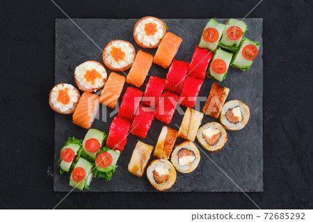 Big set of rolls with shrimp, salmon, eel, tuna and flying fish roe 72685292