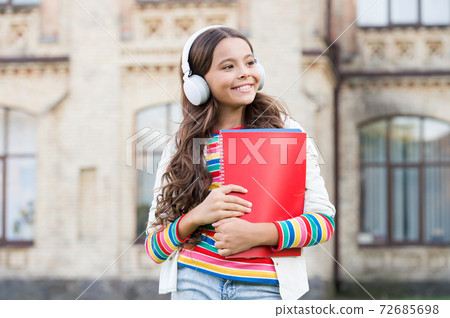 Do you speak english. Happy child listening to English Do you speak english. Happy child listening to English 72685698