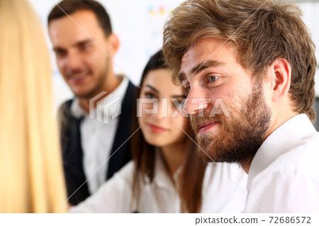 Group of people sit in office deliberate on problem 72686572