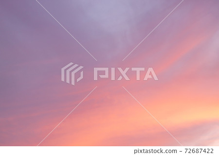 Pink sky background with white clouds 72687422