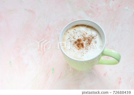 Cup of latte coffee on light pink background Cup of latte coffee on light pink background 72688439