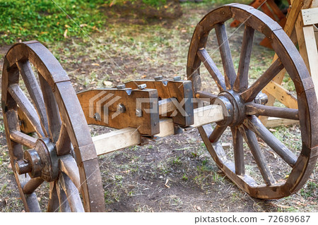 old wooden base for a cannon with large wheels old wooden base for a cannon with large wheels 72689687