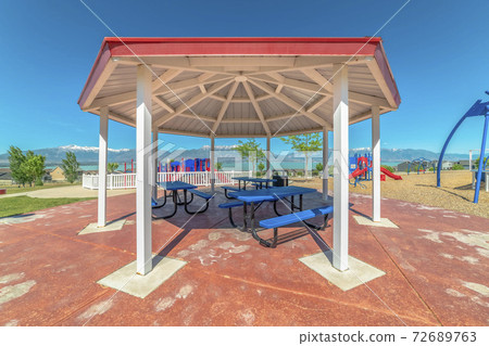 Octagon shape pavilion with scenic Timpanogos mountains and lake background 72689763