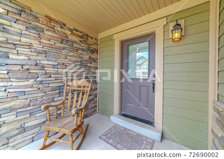 Rocking chair on the porch of a house Rocking chair on the porch of a house 72690002