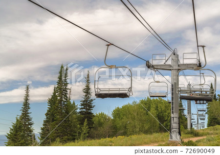 Scenic views in Park City Utah during off season at a ski resort with chairlifts Scenic views in Park City Utah during off season at a ski resort with chairlifts 72690049