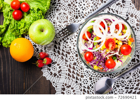 fresh salad bowl mixed greens vegetable in a dish 72690421
