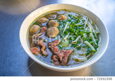 Bowl of tasty Vietnamese Pho noodle and beef meat balls 72692896