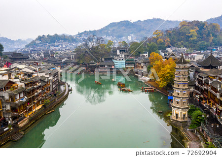 Peaceful morning in FengHuang ancient town beside TuoJiang river Peaceful morning in FengHuang ancient town beside TuoJiang river 72692904
