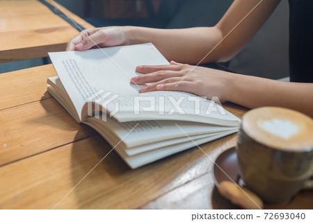 Young woman reading book in the morning Young woman reading book in the morning 72693040