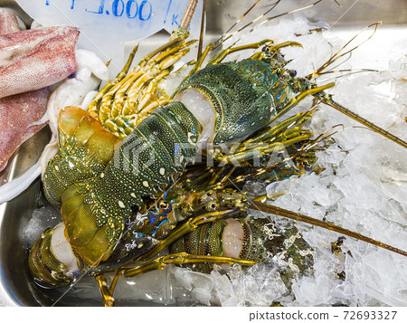 Fresh lobster for sale at frozen seafood stall in supermarket Fresh lobster for sale at frozen seafood stall in supermarket 72693327
