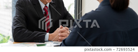 business professionals sitting around table meeting colleagues working together brainstorming on project discussing and planning concept at office business professionals sitting around table meeting colleagues working together brainstorming on project discussing and planning concept at office 72693524