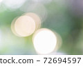 Soft blurred green and gold color background with bokeh. Abstract gradient desktop wallpaper. 72694597