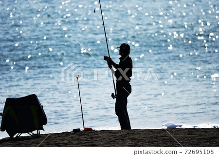 Fisherman at the beach 72695108