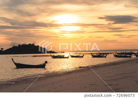 The beach in the morning on Koh Lipe and Long tail boat in the morning The beach in the morning on Koh Lipe and Long tail boat in the morning 72696073