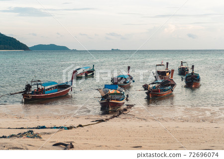 The beach in the morning on Koh Lipe and Long tail boat in the morning The beach in the morning on Koh Lipe and Long tail boat in the morning 72696074