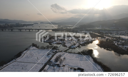 Winter sunset water garden 72696257