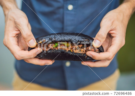 Vietnamese Pork Banh Mi Sandwich in a black baguette 72696486