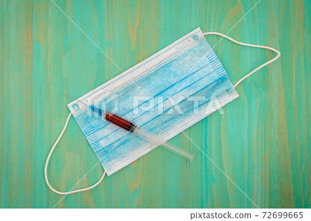 Surgical face mask and syringe with vaccine or Surgical face mask and syringe with vaccine or 72699665