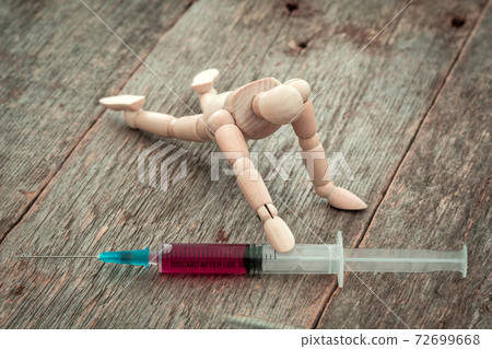 Sick man trying to grab syringe with vaccine from 72699668