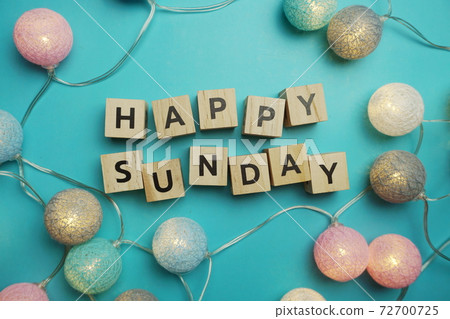 Happy sunday alphabet letter with LED Cotton ball Decoration on blue background Happy sunday alphabet letter with LED Cotton ball Decoration on blue background 72700725