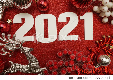 Happy New Year 2021 Decoration with Christmas ornament Flat lay on red glitter background 72700841