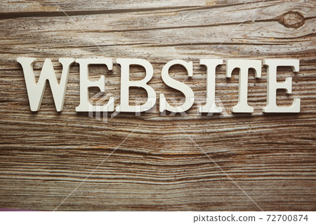 Website alphabet letter on wooden background Website alphabet letter on wooden background 72700874