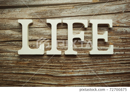 Life alphabet letter on wooden background Life alphabet letter on wooden background 72700875