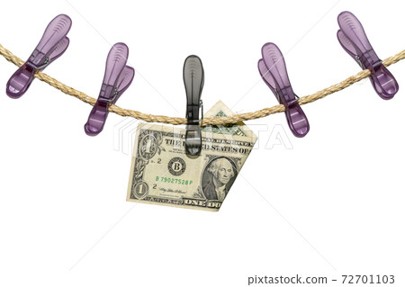 One US Dollar bill note on a washing line 72701103
