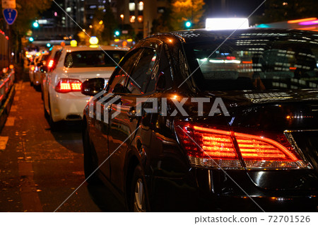 Taxi waiting for customers at night Taxi waiting for customers at night 72701526