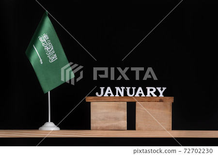 Wooden calendar of January with Saudi Arabia flag on black background. Dates of Saudi Arabia in January Wooden calendar of January with Saudi Arabia flag on black background. Dates of Saudi Arabia in January 72702230