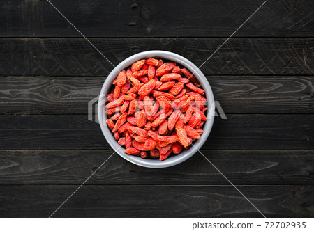 Goji berries in a bowl. Top view 72702935